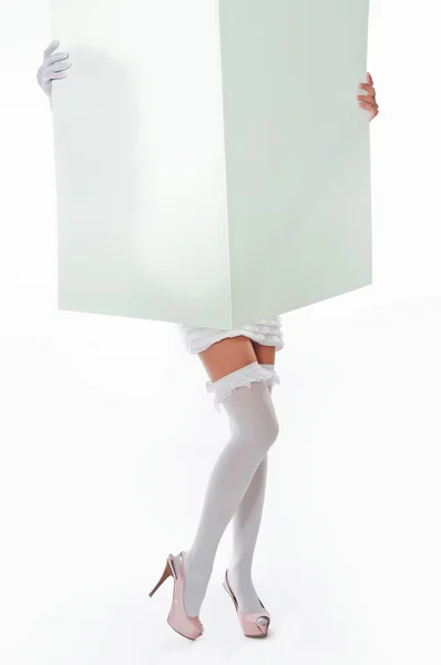 Girl holding a large sheet of paper — Stock Photo, Image