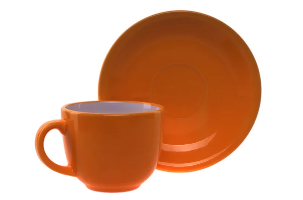 Orange Tasse und Untertasse — Stockfoto
