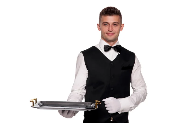 Un joven camarero con una bandeja — Foto de Stock