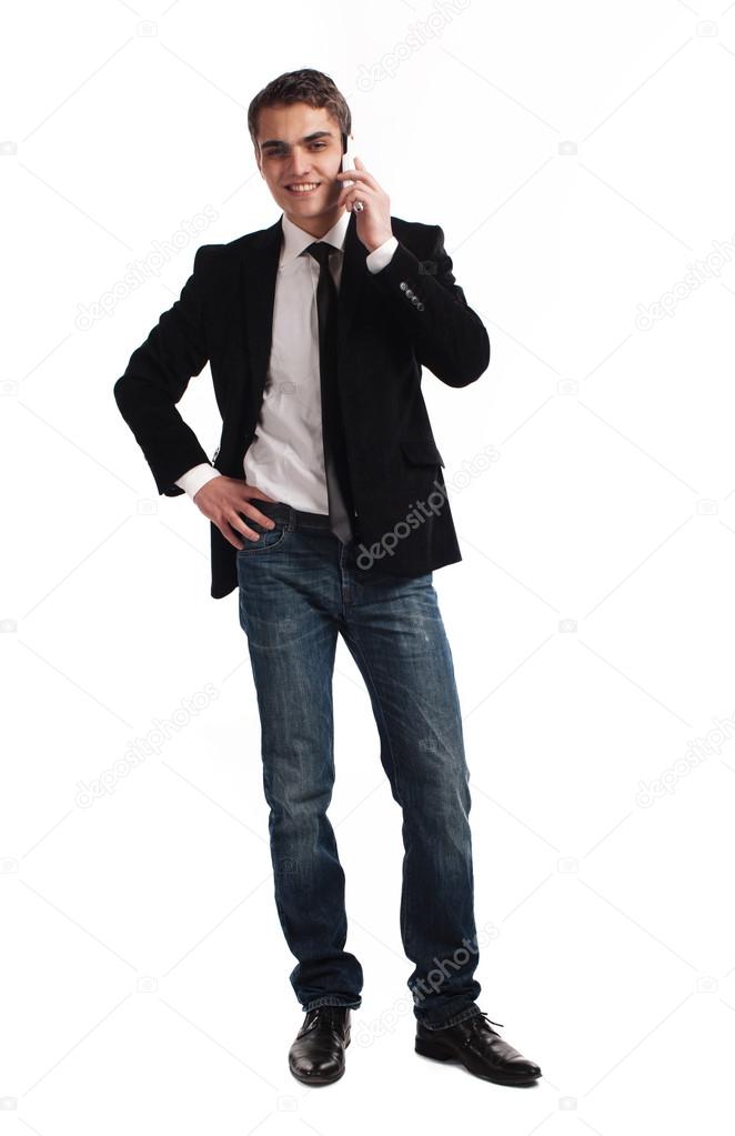 Young happy man holding mobile phone