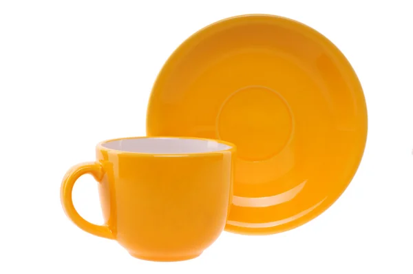 Taza de naranja y platillo — Foto de Stock