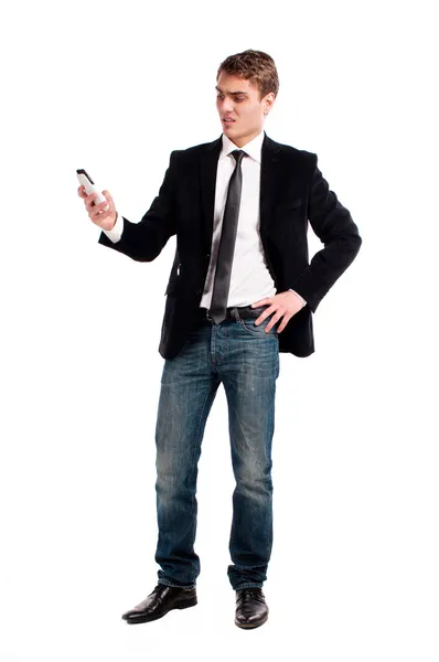 Młody człowiek szczęśliwy, trzymając telefon komórkowy — Zdjęcie stockowe