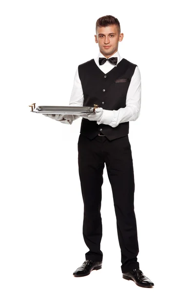 Ένα νεαρό αγόρι σερβιτόρος με ένα δίσκο — Φωτογραφία Αρχείου
