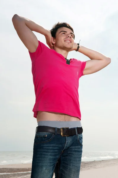 A young man in jeans and a shirt — Stock Photo, Image