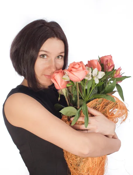 花を持つ美しい女性 ストック画像
