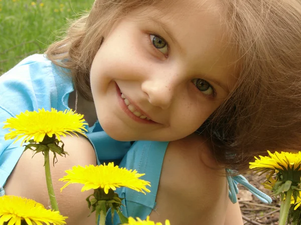 Child with dandelions — Stock Photo, Image