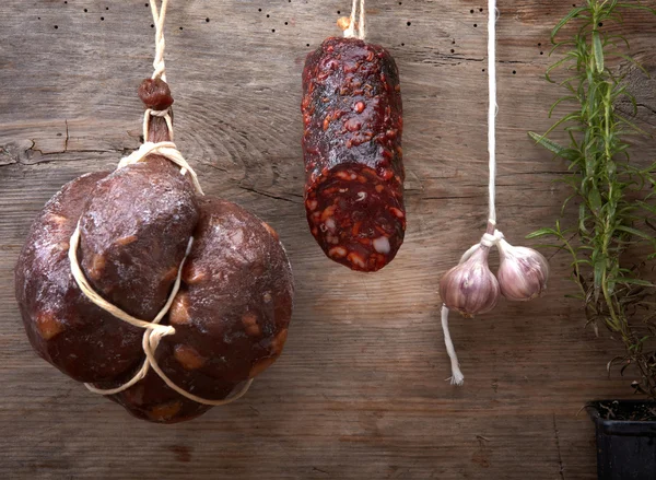 Various hanging salami sausages — Stock Photo, Image