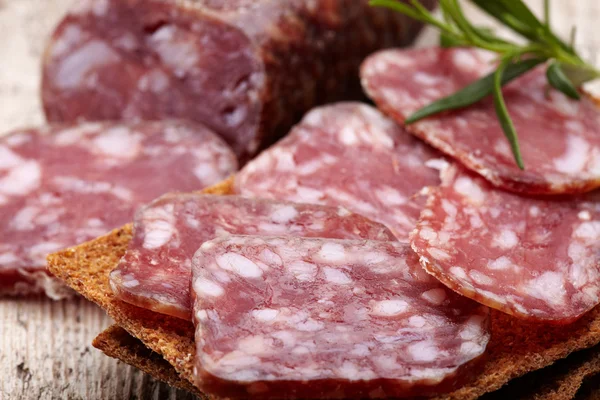 Salami sausage and bread — Stock Photo, Image