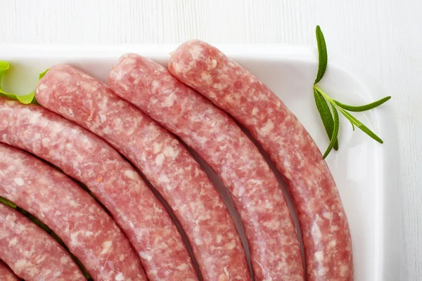 Fresh raw minced meat sausages — Stock Photo, Image
