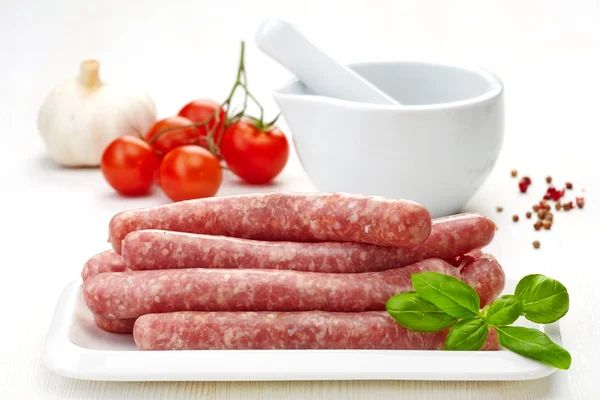 Fresh raw minced meat sausages — Stock Photo, Image