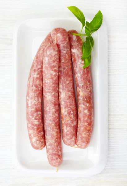 Fresh raw minced meat sausages — Stock Photo, Image