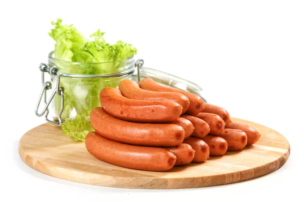 Sausages on cutting board — Stock Photo, Image