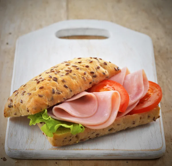 Sandwich with ham and tomatoes — Stock Photo, Image