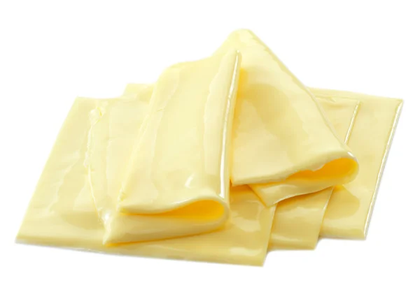 Сливочные ломтики сыра — стоковое фото