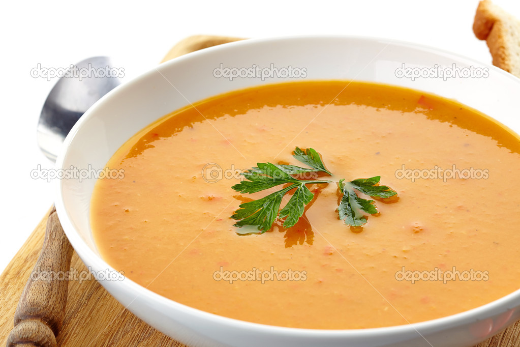 squash soup in a white plate