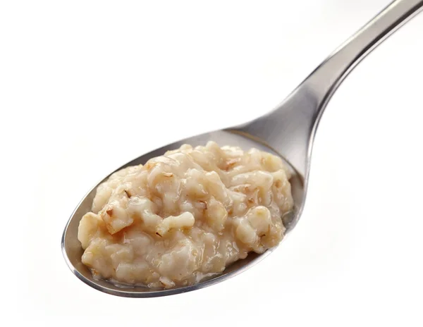 Spoon of oats porridge — Stock Photo, Image