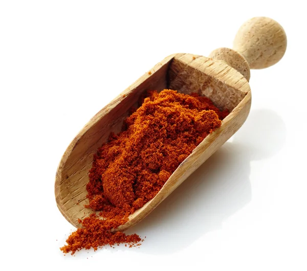 Wooden scoop with paprika powder — Stock Photo, Image