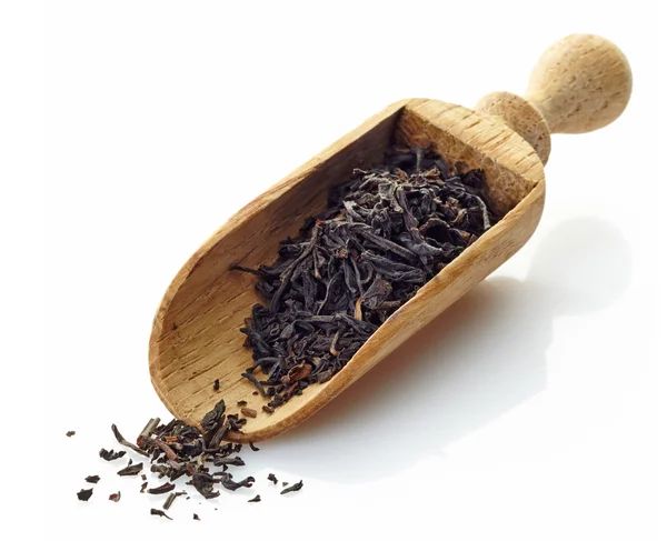 Misurino di legno con tè nero — Foto Stock