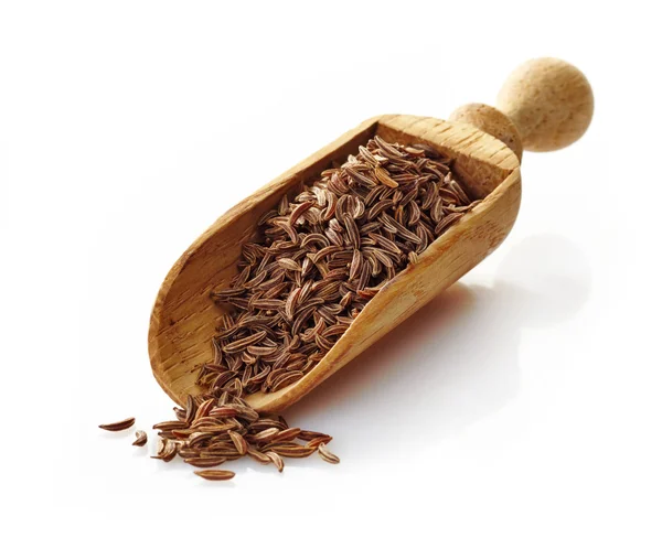 Wooden scoop with cumin — Stock Photo, Image