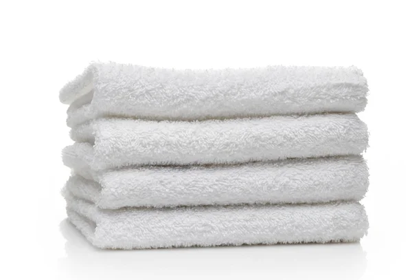 Stack of white hotel towels on a white background — Stock Photo, Image