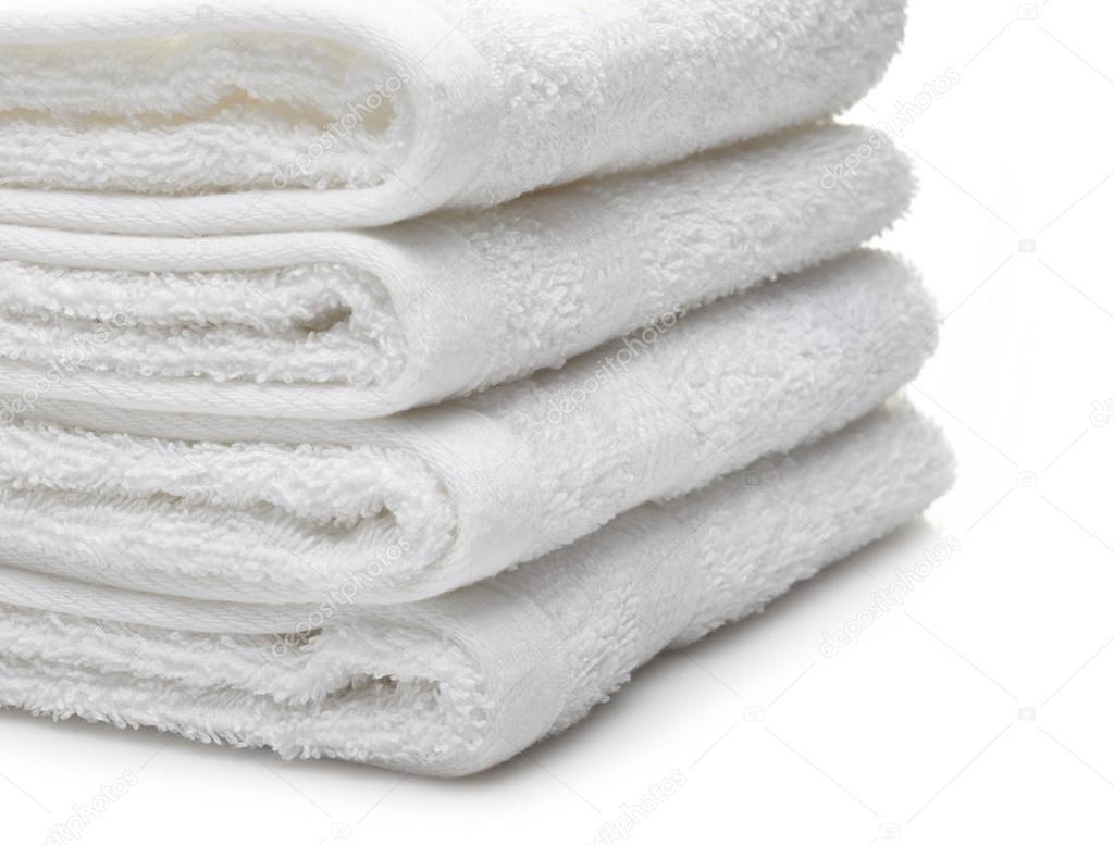 Stack of white hotel towels on a white background ⬇ Stock Photo, Image