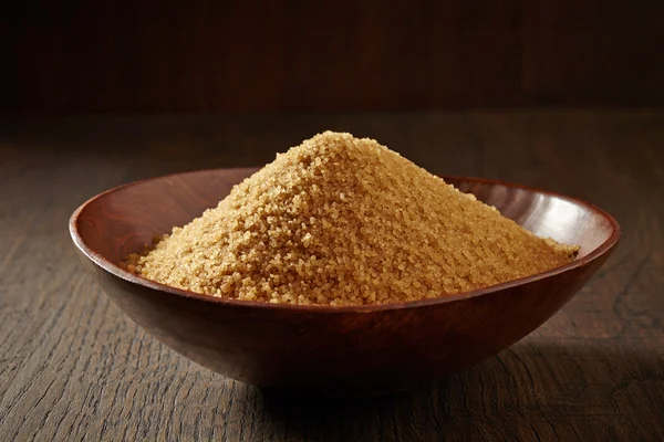 Brown sugar in a wooden bowl — Stock Photo, Image