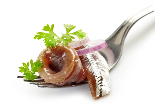 Tenedor con rollo de anchoa —  Fotos de Stock