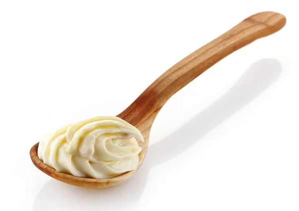 Деревянная ложка со сливочным сыром — стоковое фото