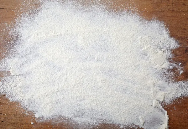 White flour on wooden table — Stock Photo, Image
