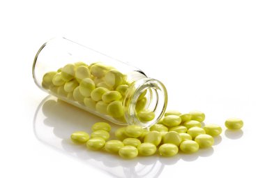bottle of yellow valerian extract pills clipart