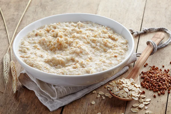 Bowl of various flakes porridge — Stock Photo, Image