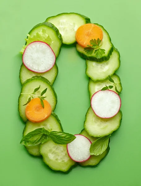 O letter made of raw vegetables — Stock Photo, Image