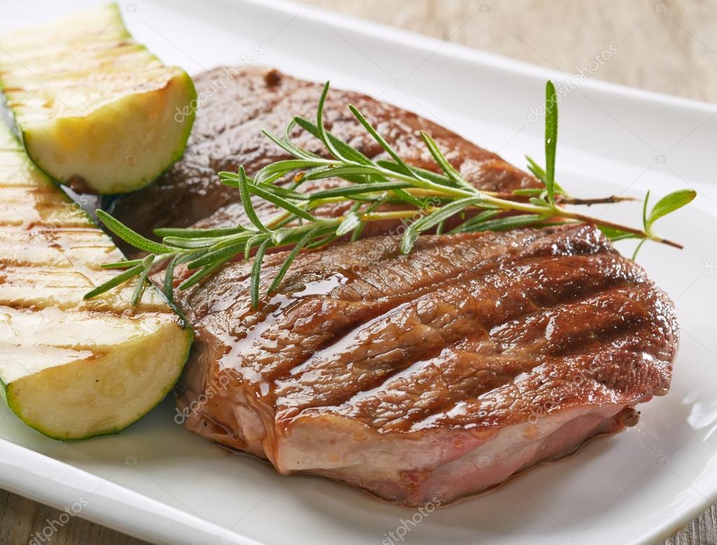 grilled beef steak and zucchini