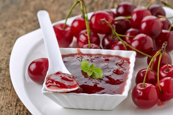 Bowl of fruit jam with cherries — Stock Photo, Image