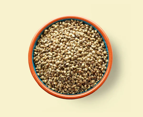 Bowl Hemp Seeds Yellow Background Top View — Stock Photo, Image