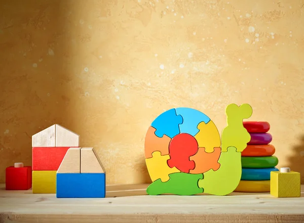 Colorful Wooden Toys Shelf Yellow Wall Background — Stock Photo, Image