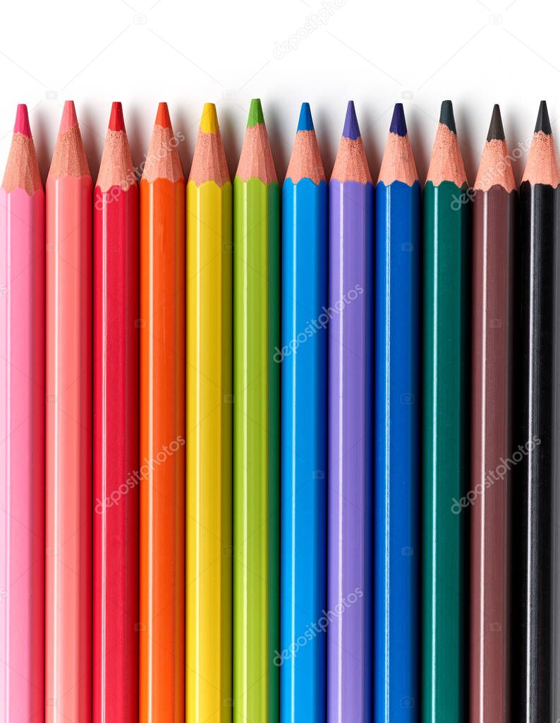 colorful wood pencils closeup on white background, top view