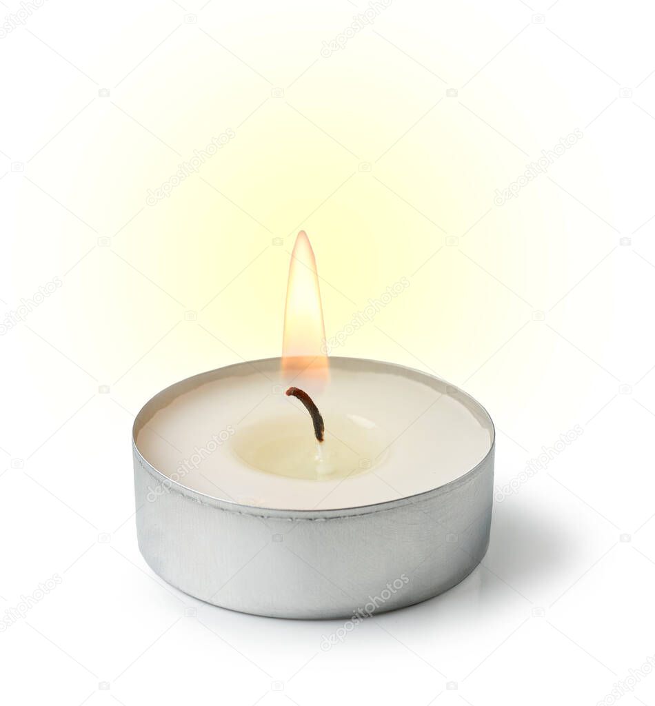burning tea light candle isolated on white background