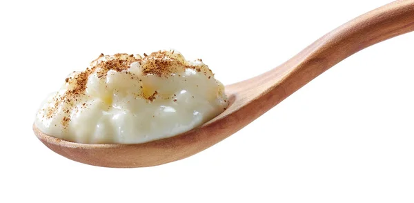 Budín Leche Arroz Con Canela Una Cuchara Madera Aislada Sobre —  Fotos de Stock