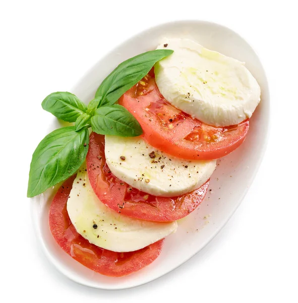 Teller Mit Tomaten Und Mozzarella Mit Basilikum Und Olivenöl Isoliert — Stockfoto