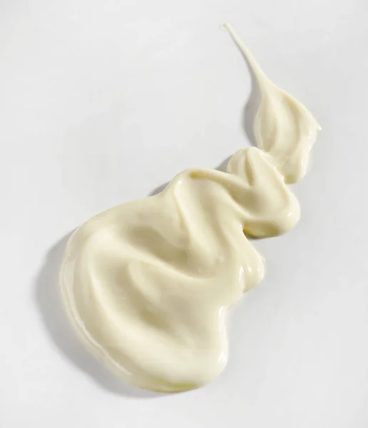 Расплавленный Белый Шоколад Белом Фоне Вид Сверху — стоковое фото