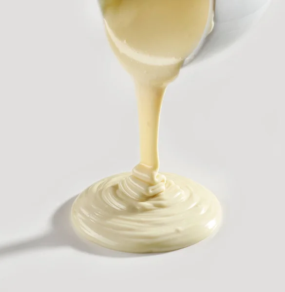 Melted White Chocolate Pouring White Background — Stockfoto