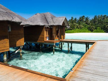 Vacation paradise over sea, maldives clipart