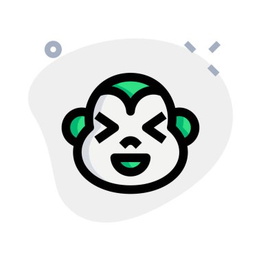 maymun aynı anda sırıtıyor ve şaşı bakıyor.