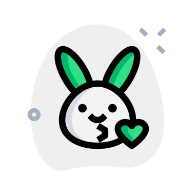 Tavşanın gözleri açık, emojiyi kalbiyle üflüyor.