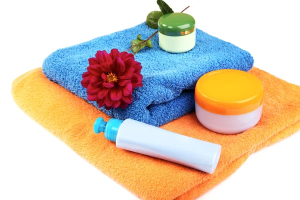 Still-life with bath towel shampoo and a flower — Stock Photo, Image