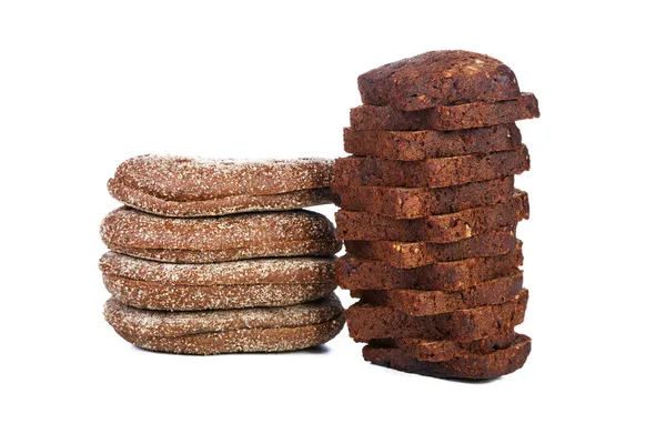 Two piles of slices black bread isolated on a white background — Stock Photo, Image
