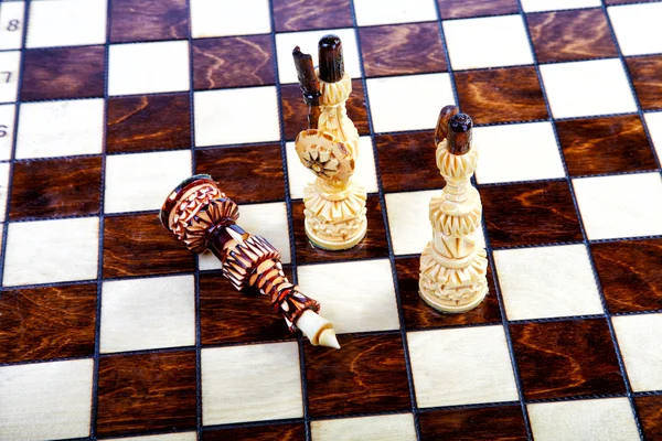 Chessboard with decorative chessmen — Stock Photo, Image