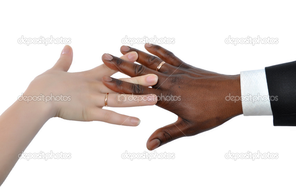 Female white and black man's hand newly married