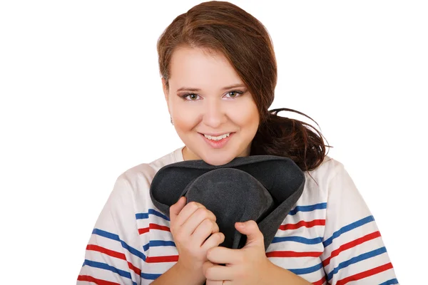 De lachende mollig meisje met een hoed geïsoleerd op wit — Stockfoto